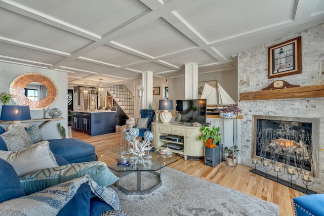 54 Webhannet Dr, Wells, ME 04090 - living room with coffered ceiling, wood finished floors, stairs, and a stone fireplace