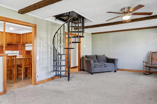 living room with ceiling fan, light colored carpet, beam ceiling, and a textured ceiling