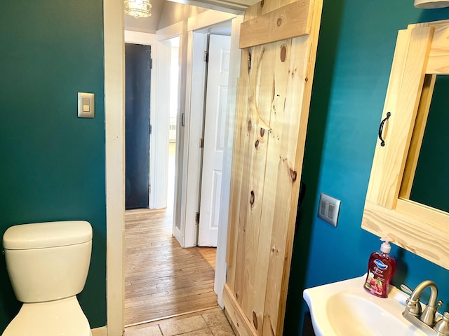 bathroom featuring sink and toilet