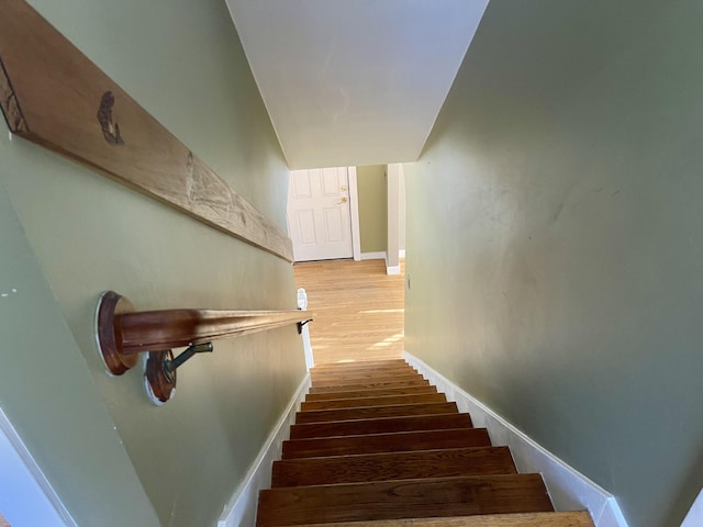 stairway featuring hardwood / wood-style floors