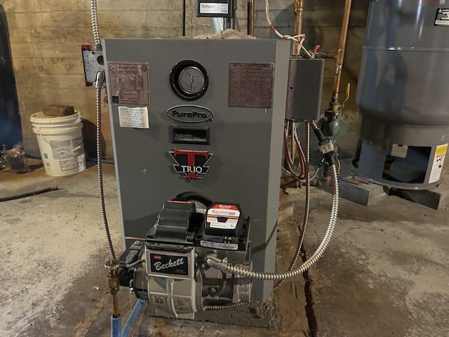 utility room with water heater