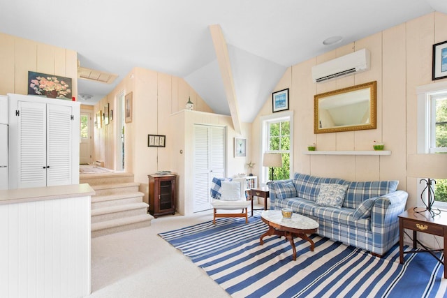 carpeted living room featuring lofted ceiling, a healthy amount of sunlight, and a wall mounted AC