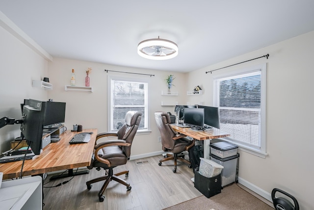 office with light hardwood / wood-style floors