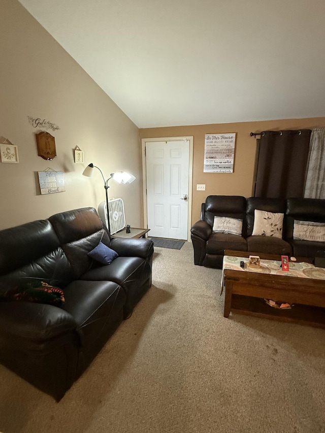 carpeted living room featuring lofted ceiling