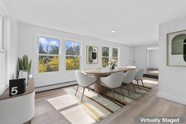 dining room featuring baseboards, a baseboard radiator, wood finished floors, and recessed lighting
