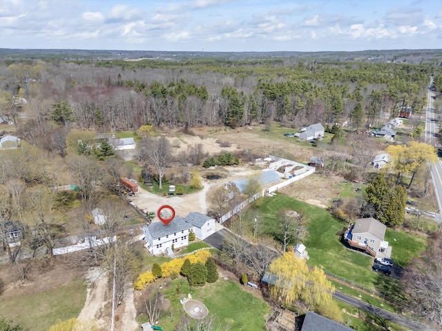 drone / aerial view with a view of trees