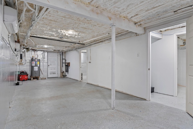 unfinished below grade area featuring water heater