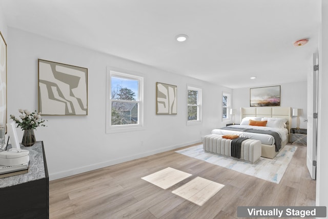 bedroom featuring light wood-style floors, recessed lighting, and baseboards