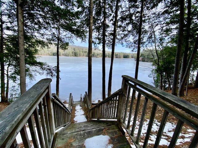 wooden terrace with a water view