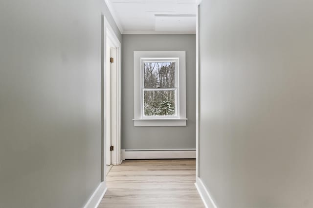 hall featuring a baseboard radiator, crown molding, and light hardwood / wood-style flooring