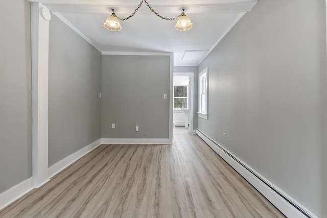 unfurnished room with ornamental molding, light wood-type flooring, and baseboard heating