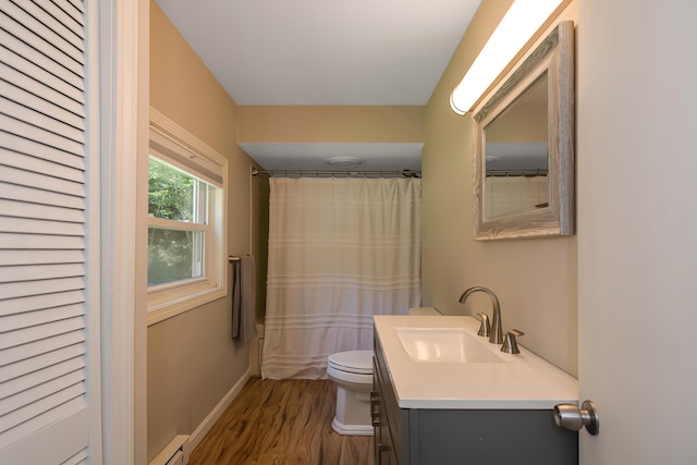 bathroom with toilet, a baseboard radiator, vanity, a shower with shower curtain, and hardwood / wood-style floors