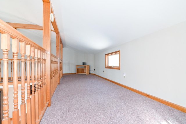 interior space featuring lofted ceiling and carpet flooring