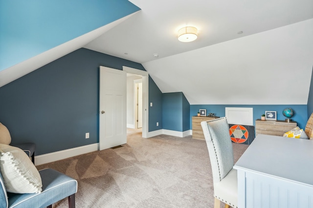 home office featuring lofted ceiling and light colored carpet