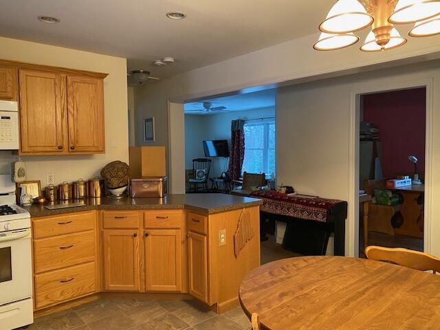 kitchen with white appliances and kitchen peninsula