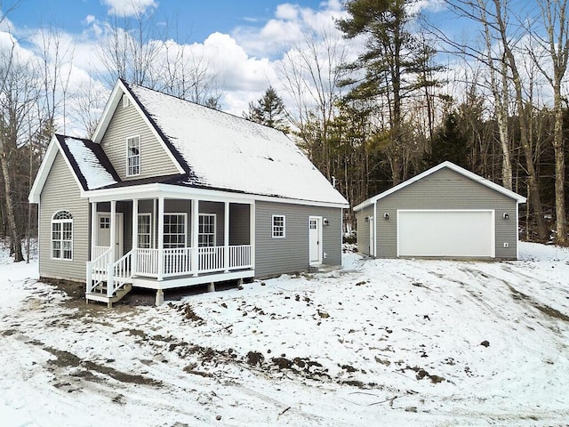 view of front of house featuring a garage, an outdoor structure, and a porch