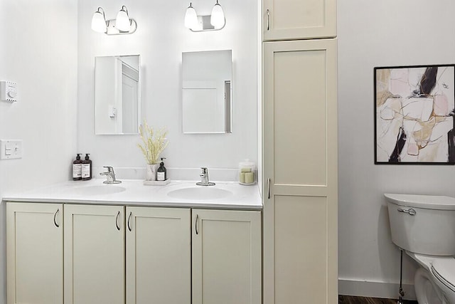 bathroom featuring vanity and toilet