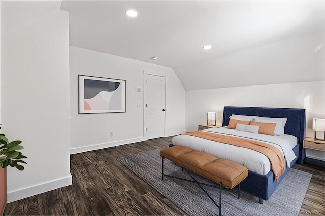 bedroom featuring vaulted ceiling and dark hardwood / wood-style floors