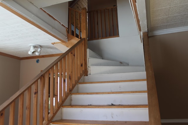 staircase with crown molding