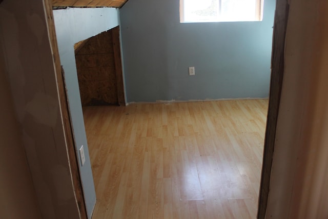 bonus room with light wood-type flooring