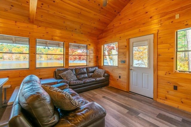 living room featuring wood ceiling, hardwood / wood-style flooring, vaulted ceiling, and wooden walls