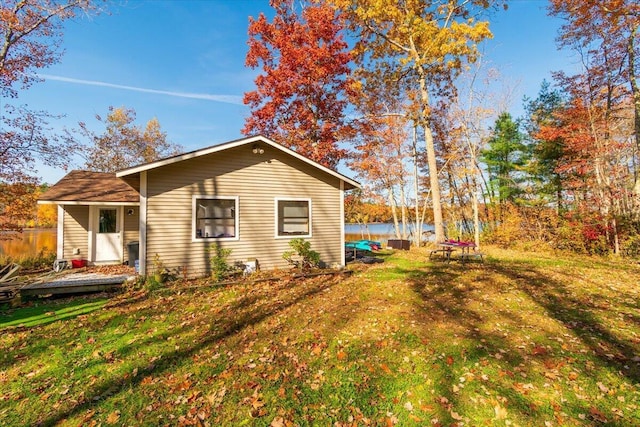 view of property exterior with a lawn