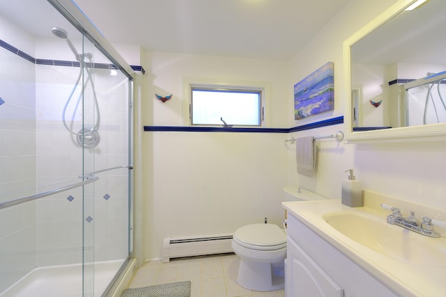 bathroom featuring baseboard heating, tile patterned flooring, vanity, a shower with shower door, and toilet