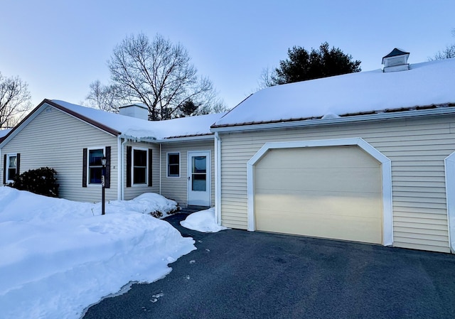 ranch-style home with a garage