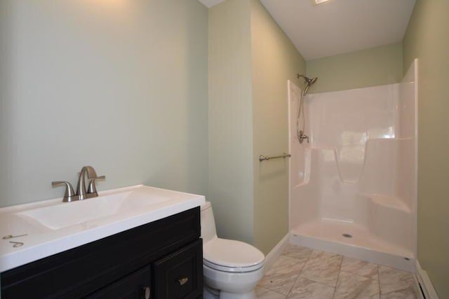 bathroom featuring walk in shower, vanity, and toilet