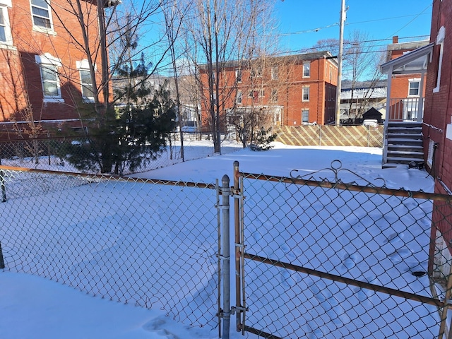 view of yard covered in snow