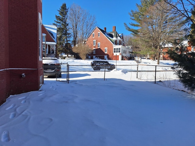 view of yard layered in snow