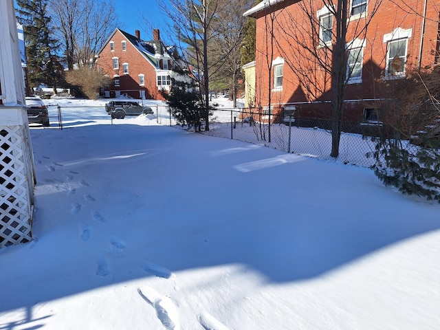 view of yard layered in snow