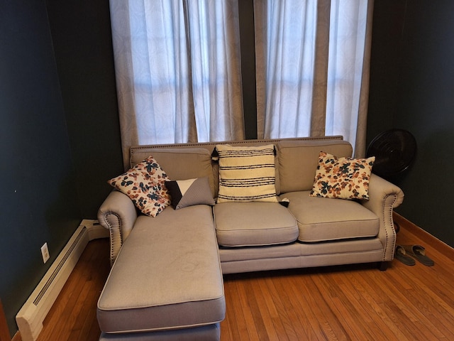 living room featuring hardwood / wood-style flooring and baseboard heating