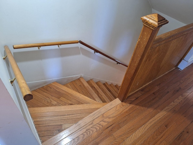 stairs with hardwood / wood-style floors