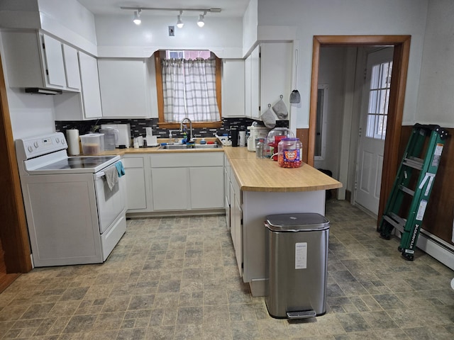 36 Erchles St, Rumford, ME 04276 - kitchen with tasteful backsplash, electric stove, a sink, and plenty of natural light