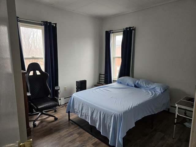 36 Erchles St, Rumford, ME 04276 - bedroom featuring baseboard heating and wood finished floors