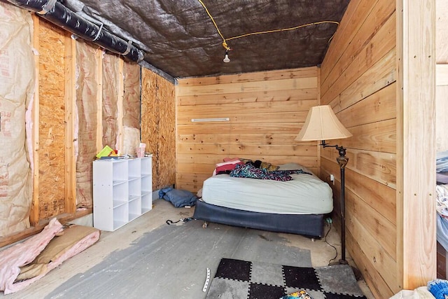 unfurnished bedroom with wooden walls