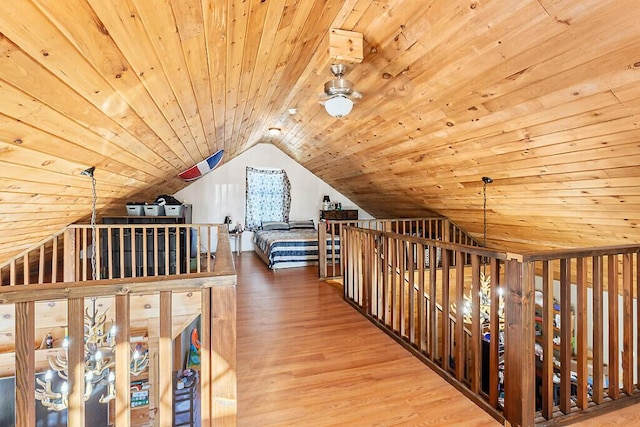 interior space featuring wood-type flooring, lofted ceiling, and wood ceiling