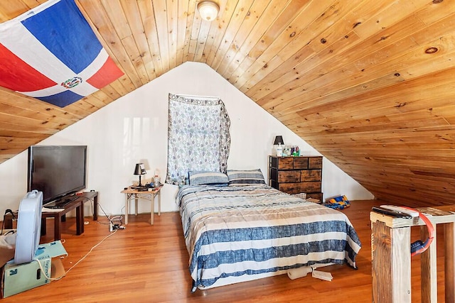 bedroom with wood ceiling, lofted ceiling, and hardwood / wood-style floors