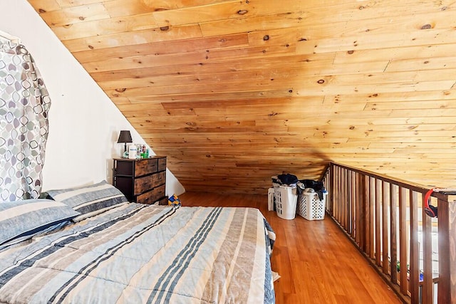 unfurnished bedroom featuring lofted ceiling, wood ceiling, and light hardwood / wood-style flooring