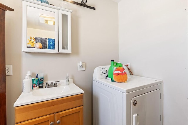 laundry room featuring sink and cabinets