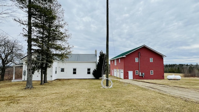 129 Shaw Hill Rd, Hampden, ME 04444 - view of property exterior featuring a yard