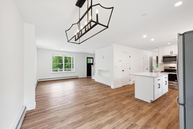 LOT9 Westhaven Ln, Wells, ME 04090 - kitchen with stainless steel appliances, a kitchen island, a baseboard heating unit, and light countertops