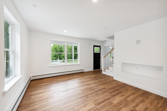 LOT9 Westhaven Ln, Wells, ME 04090 - unfurnished living room with stairway, recessed lighting, light wood-type flooring, and a baseboard heating unit