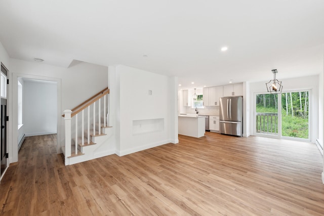 LOT9 Westhaven Ln, Wells, ME 04090 - unfurnished living room featuring stairway, recessed lighting, baseboards, and light wood-style floors