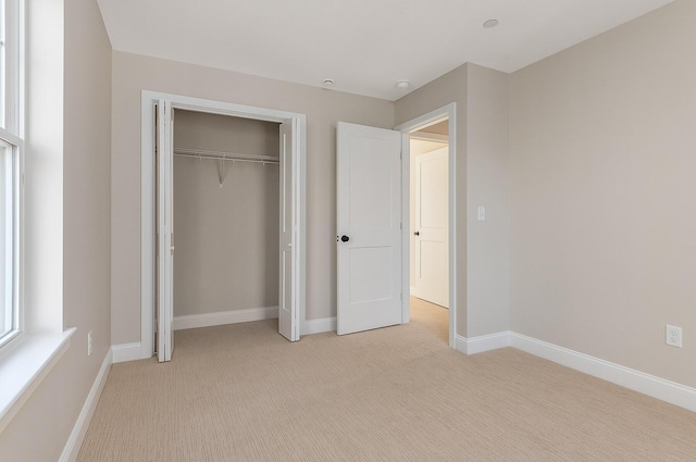 LOT9 Westhaven Ln, Wells, ME 04090 - unfurnished bedroom featuring light colored carpet, baseboards, and a closet