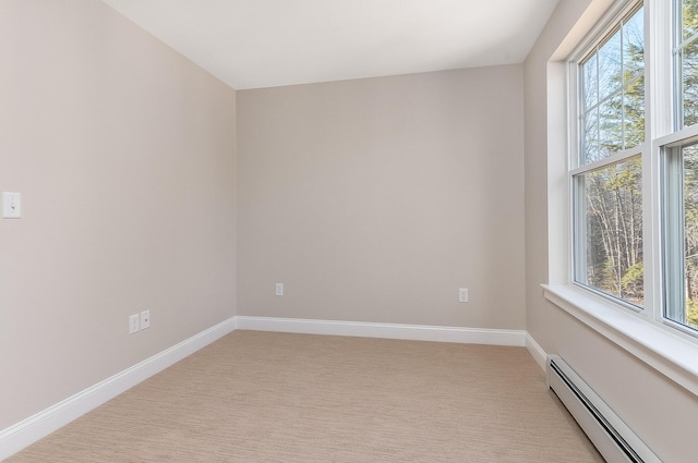 LOT9 Westhaven Ln, Wells, ME 04090 - empty room with a baseboard heating unit, healthy amount of natural light, light colored carpet, and baseboards