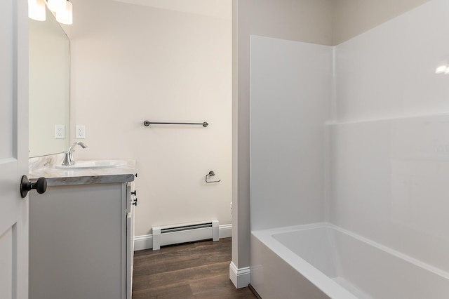 LOT9 Westhaven Ln, Wells, ME 04090 - bathroom with a baseboard radiator, vanity, wood finished floors, tub / shower combination, and baseboards