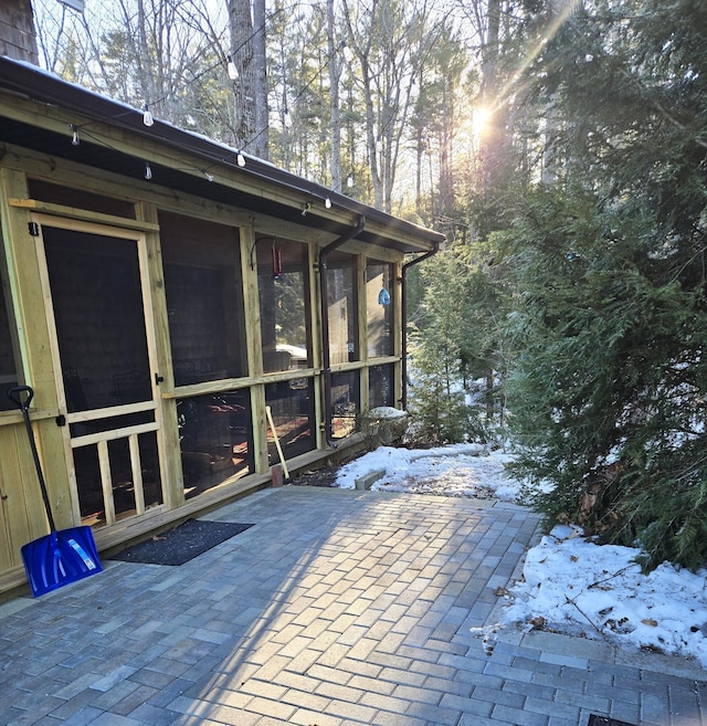 exterior space featuring a sunroom