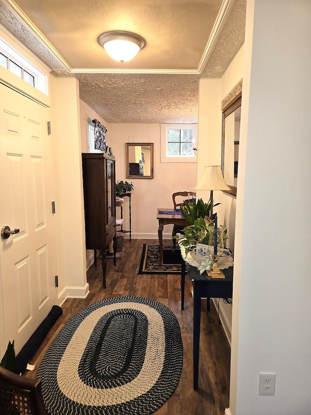 entrance foyer with dark hardwood / wood-style floors and a textured ceiling